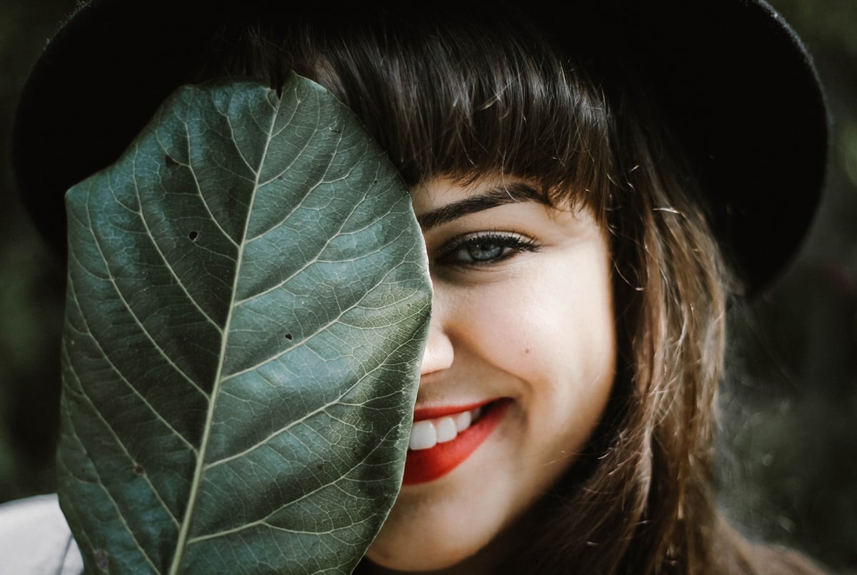 green-tech-smiling-woman-leaf